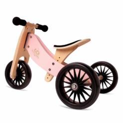 Image of the Kinderfeets Tiny Tot PLUS in Rose Pink in its three-wheel configuration, a tricycle-to-balance bike for toddlers