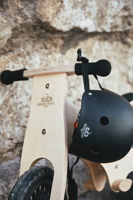 Kinderfeets helmet hanging from bike handle